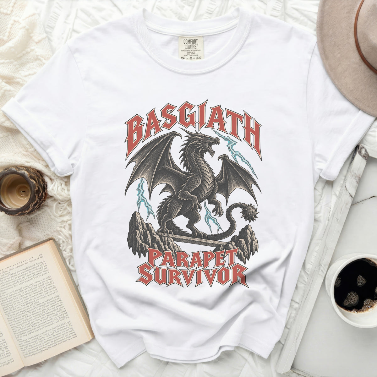 White t-shirt with "BASGIATH PARAPET SURVIVOR" text and dragon graphic.