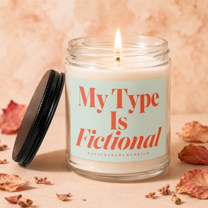 Candle with label "My Type Is Fictional" and MagicMerchEmporium text.