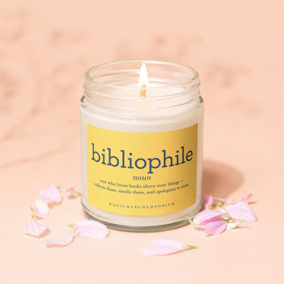 Scented candle with "bibliophile" definition on a yellow label.