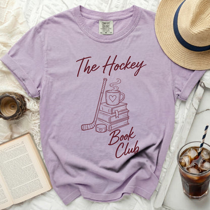 Purple t-shirt with "The Hockey Book Club" design and books.