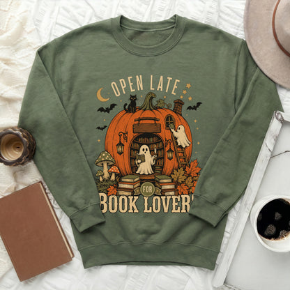 Green sweatshirt with "Open Late For Book Lovers" text and Halloween pumpkin graphic.