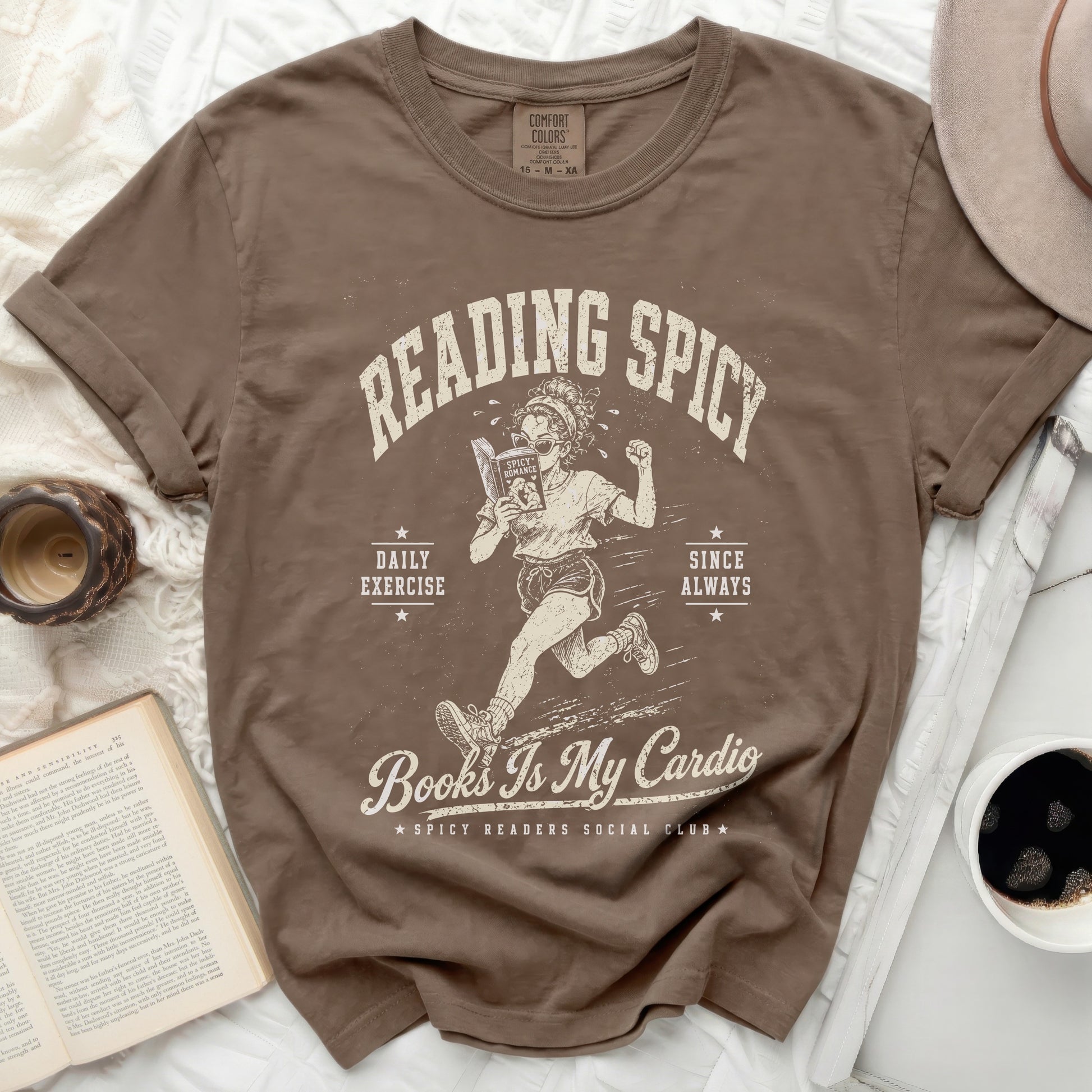 T-shirt graphic with woman running and text "Reading Spicy Books Is My Cardio".
