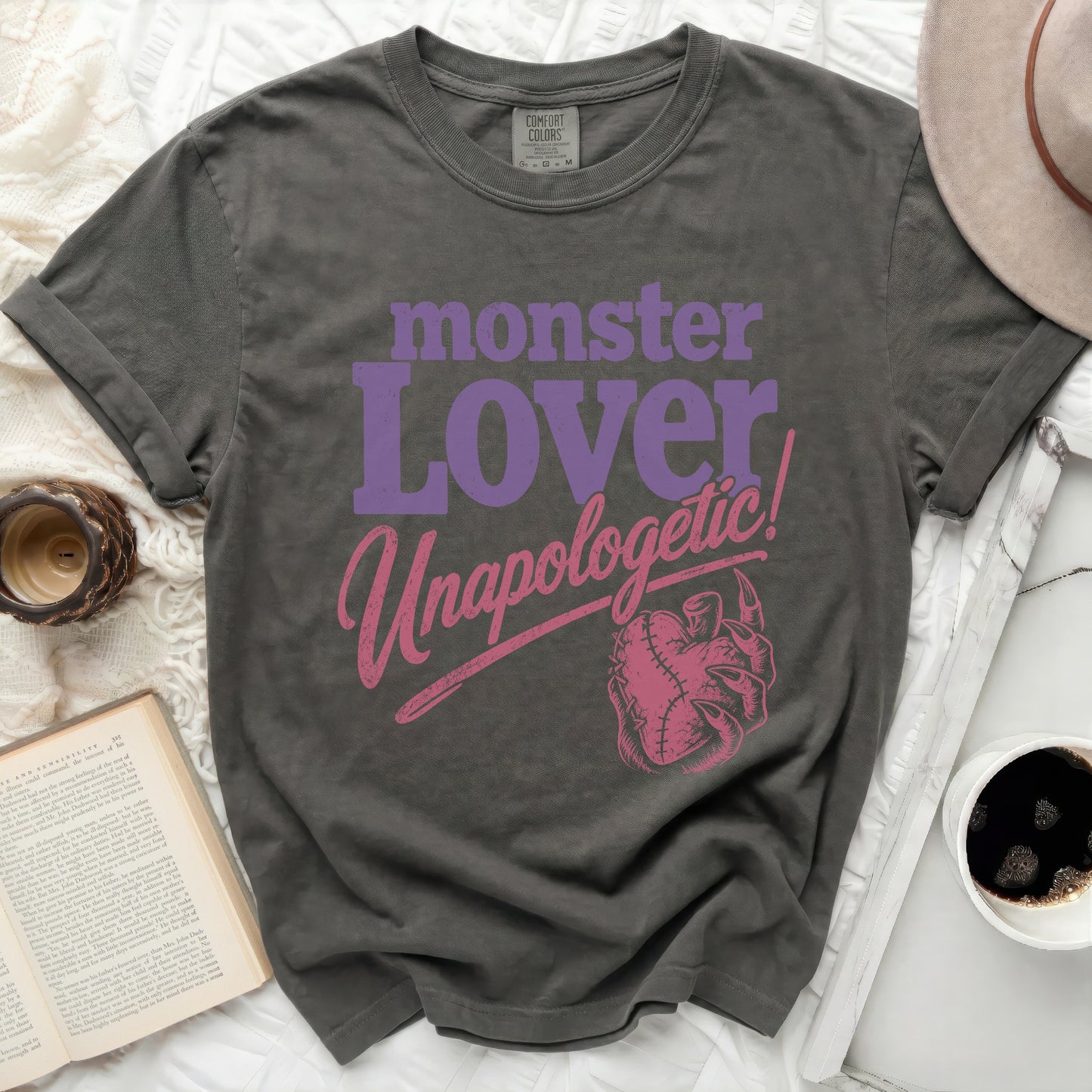 Dark gray t-shirt with purple "monster Lover" and pink "Unapologetic!" text.