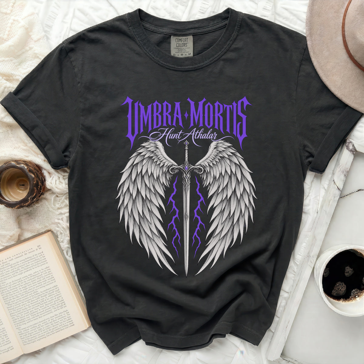 Black t-shirt with "Umbra Mortis Hunt Athalar" text, wings, sword, and lightning.