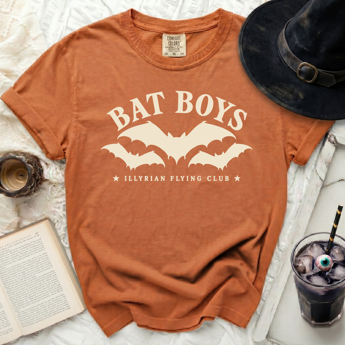 Orange t-shirt with "Bat Boys Illyrian Flying Club" graphic.