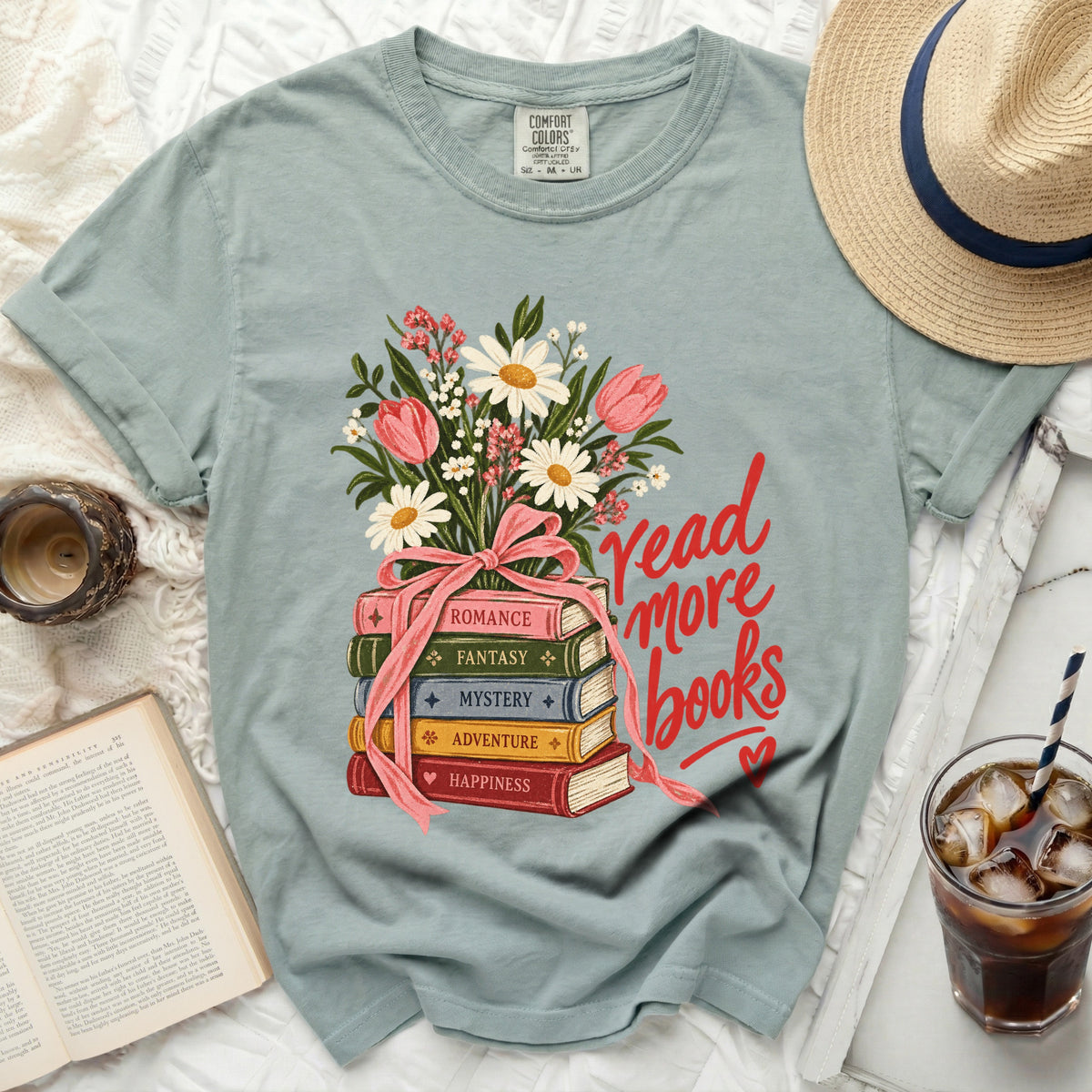 Light blue t-shirt with "Read More Books" and stack of books with flowers.