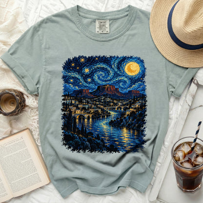 Light blue Comfort Colors t-shirt with a stylized starry night landscape print.