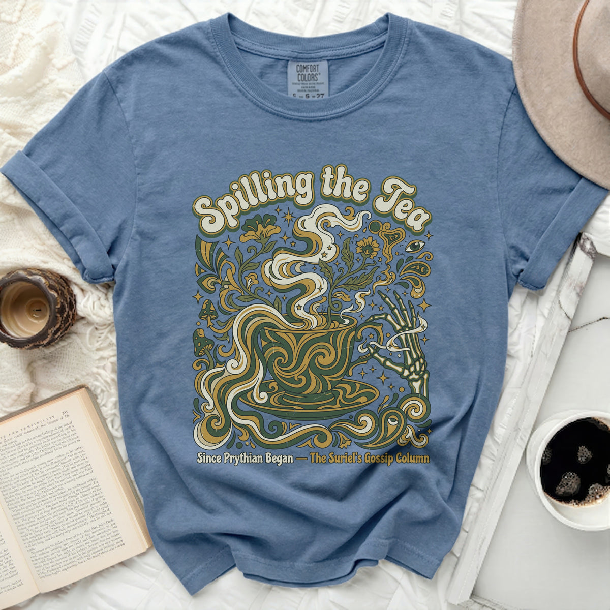 Blue Comfort Colors t-shirt with "Spilling the Tea" and floral design.