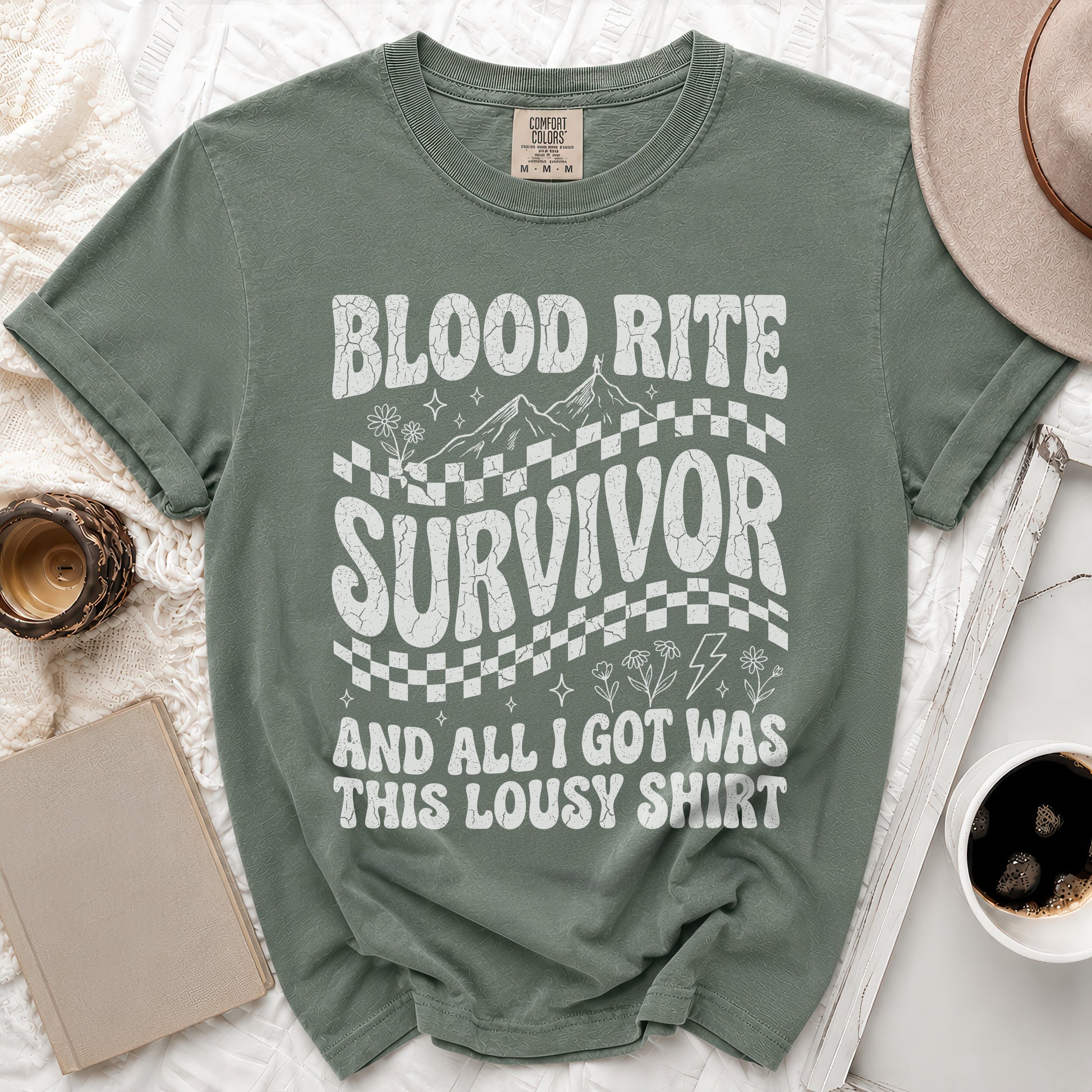 Green t-shirt with "Blood Rite Survivor And All I Got Was This Lousy Shirt" text.