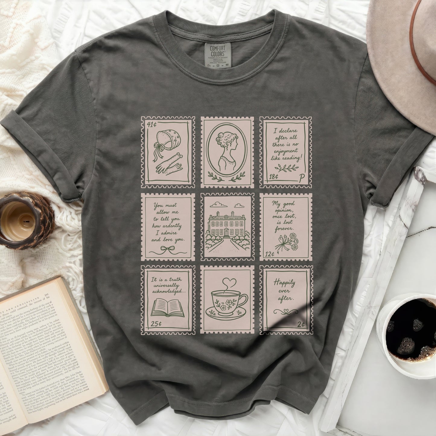 Dark grey t-shirt with nine framed illustrations resembling vintage postage stamps.