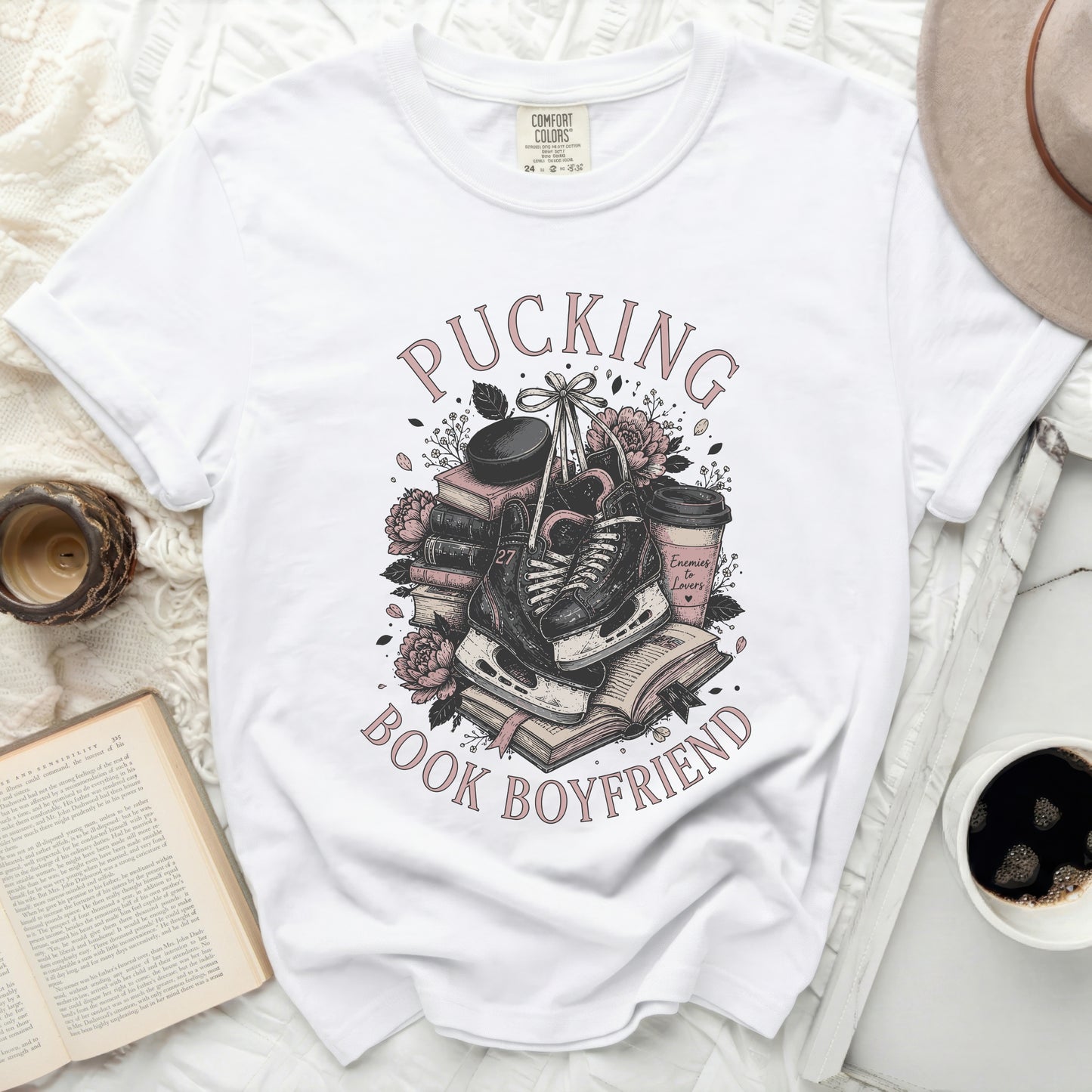 White t-shirt with "Pucking Book Boyfriend" text and ice skates graphic.