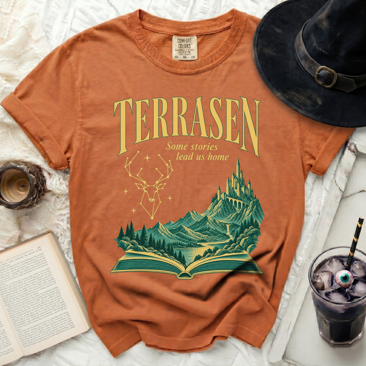 Orange t-shirt with "Terrasen" and a fantasy landscape design.