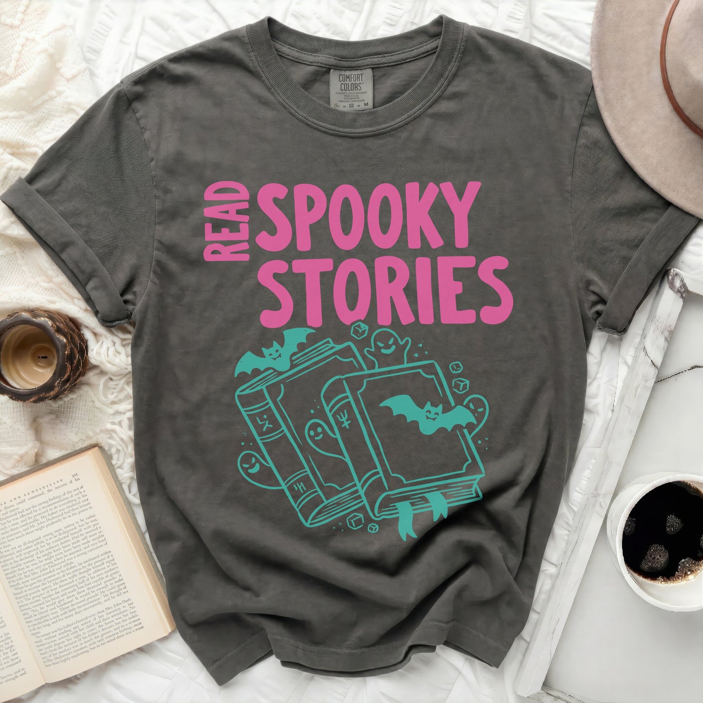 Gray t-shirt with "Read Spooky Stories" text and gothic graphics.