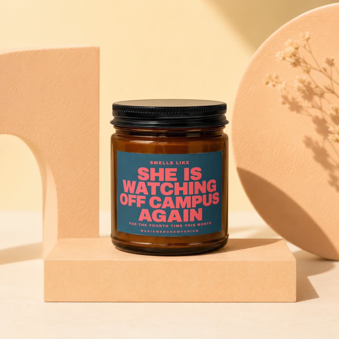 SMELLS LIKE SHE IS WATCHING OFF CAMPUS AGAIN candle with black lid.