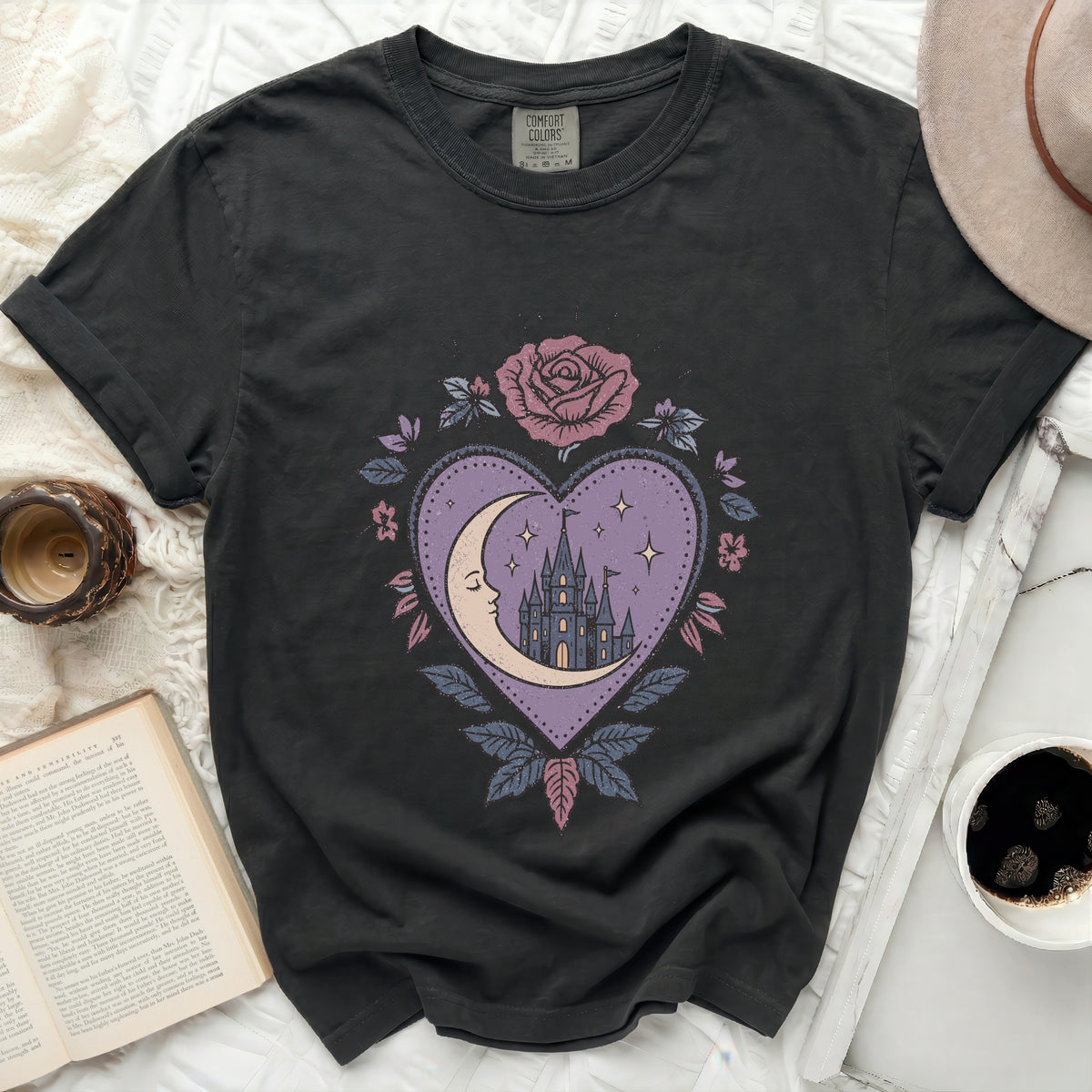 Black t-shirt with a circular pink rose and purple heart graphic.