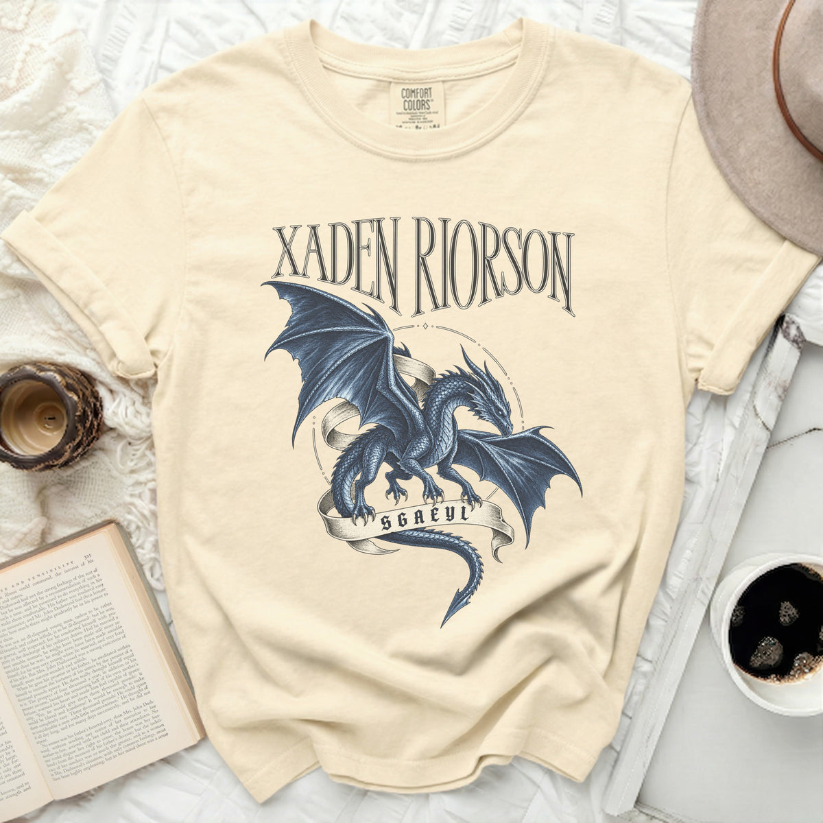 Cream t-shirt with black dragon graphic and "Xaden Riorson SGAEYL" text.