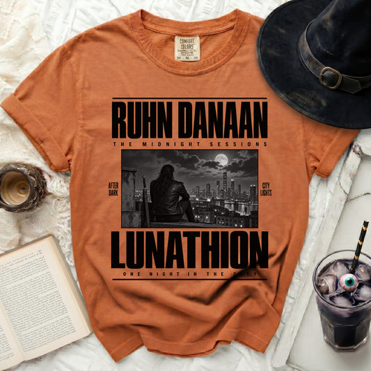 Orange t-shirt with RUHN DANAAN LUNATHION design featuring a city skyline.