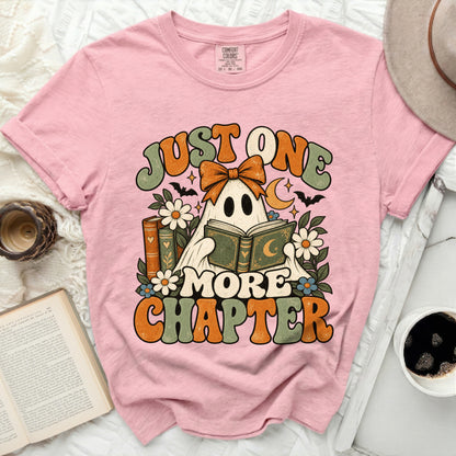 Pink t-shirt with ghost reading book graphic and text "JUST ONE MORE CHAPTER".