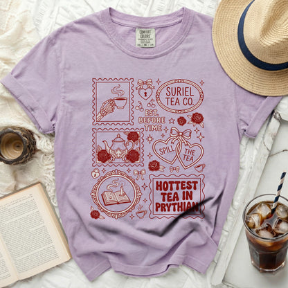 Lilac t-shirt with vintage-style red stamp graphics and text.