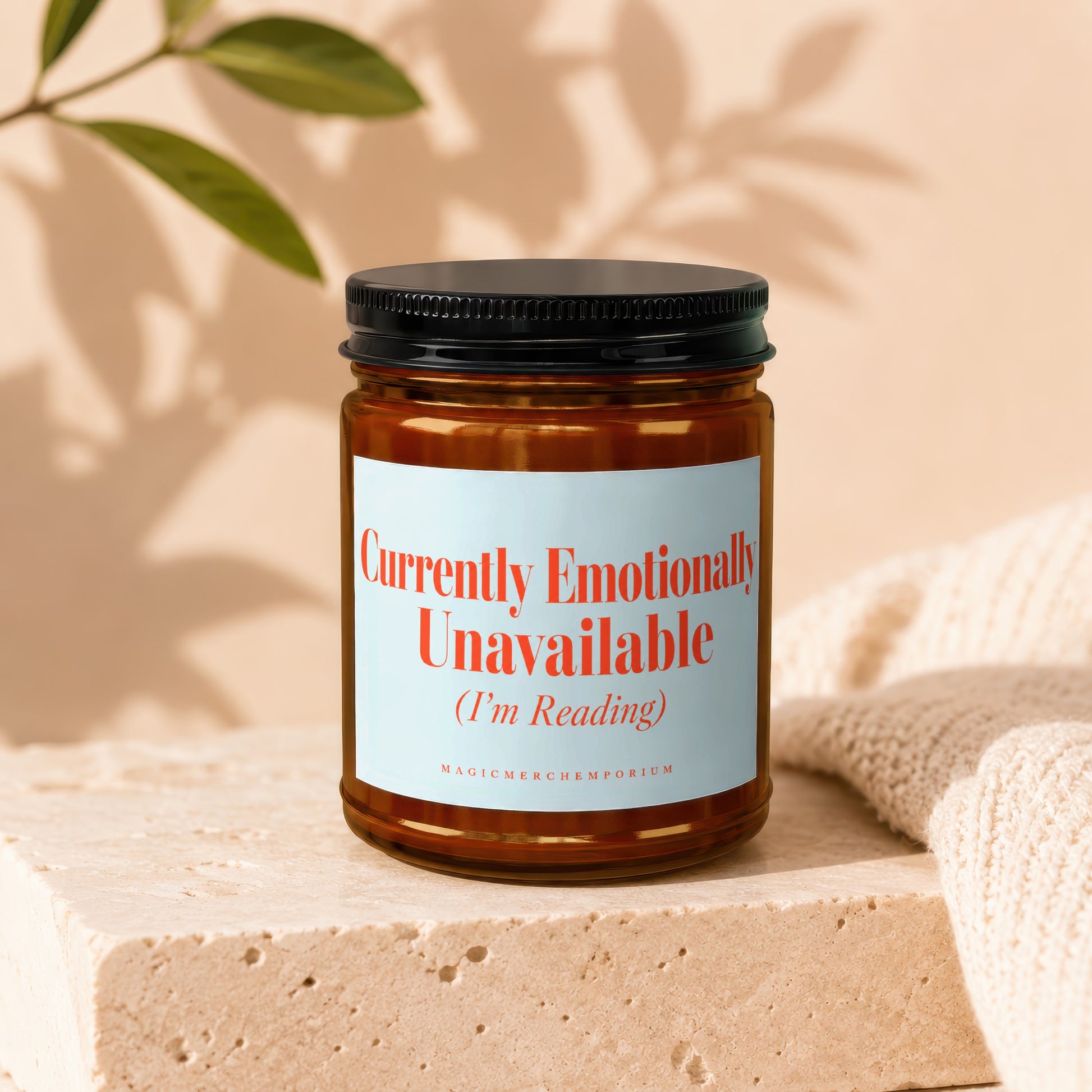 Amber candle in glass jar with black lid features "Currently Emotionally Unavailable (I'm Reading)" text.