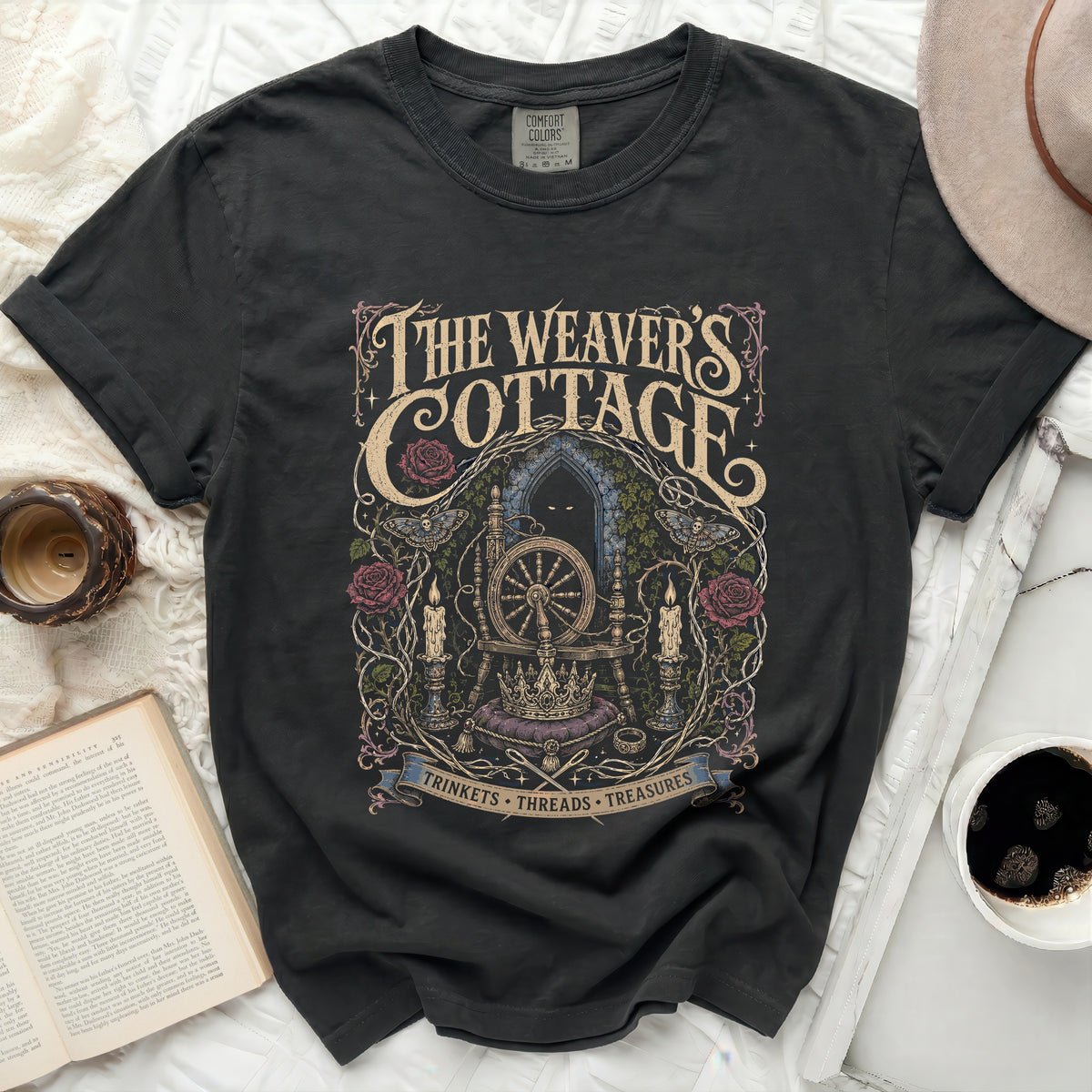Black Comfort Colors t-shirt with "The Weaver's Cottage" mystical graphic design.