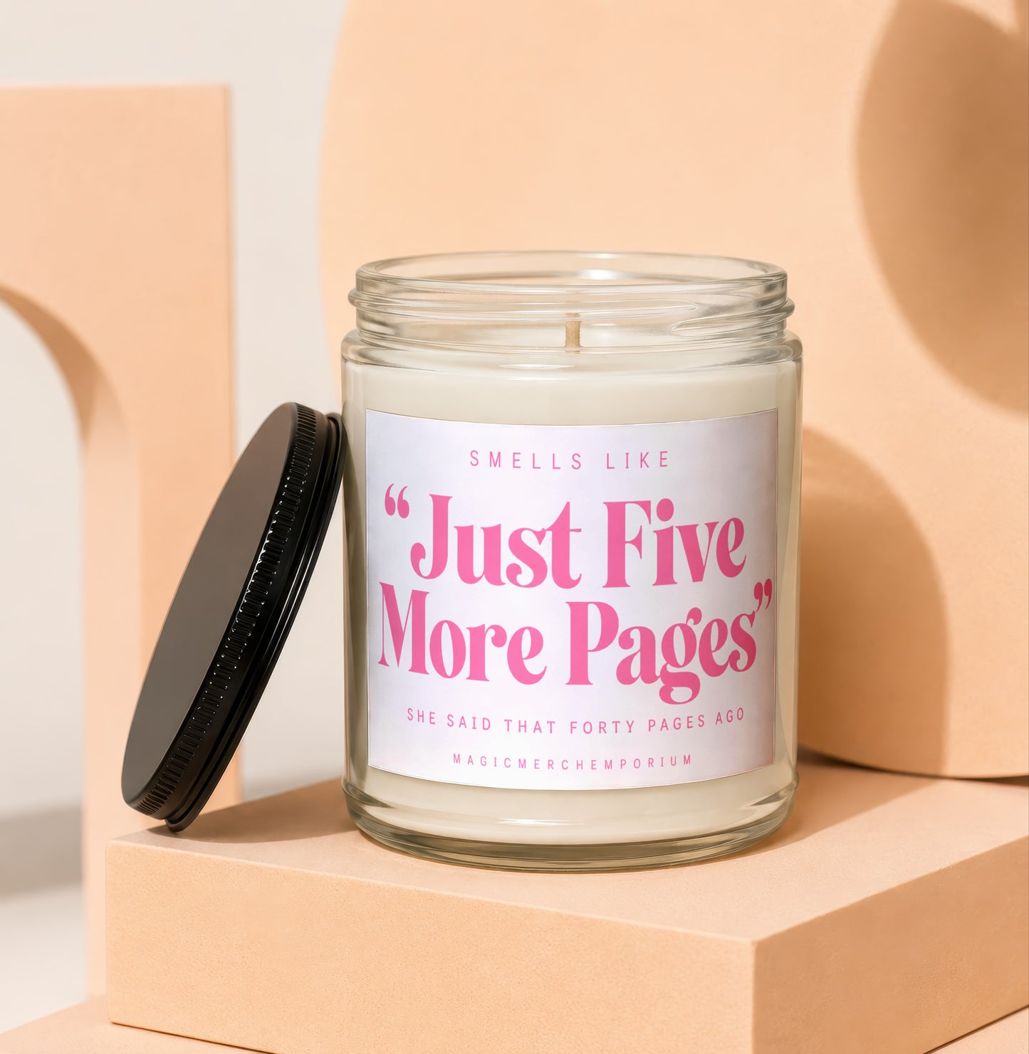Scented candle with label reading "Just Five More Pages"