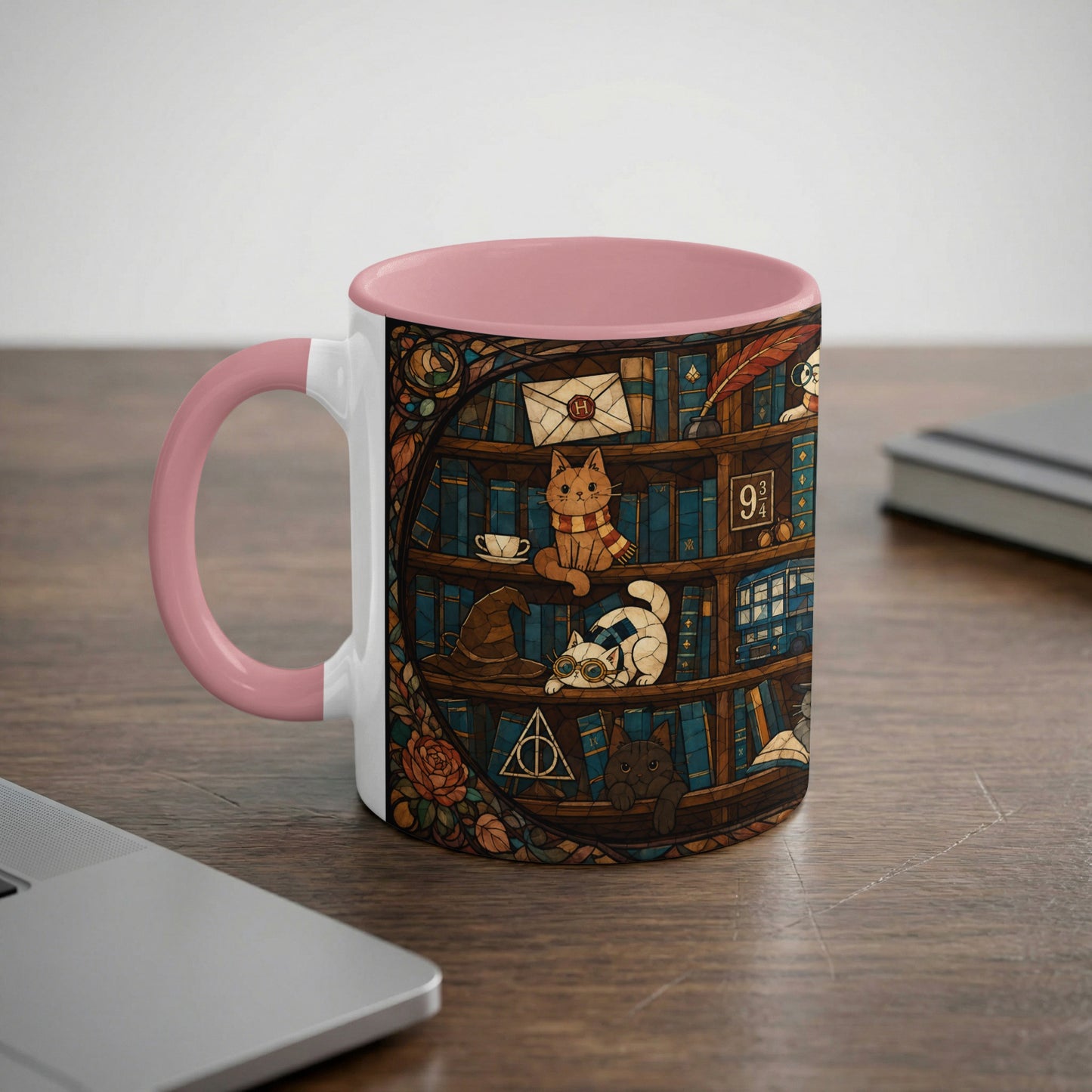Mug with a pink handle featuring cats, books, and magical symbols in a stained-glass style.