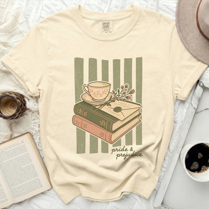 Cream t-shirt with "Pride & Prejudice" book and teacup graphic.