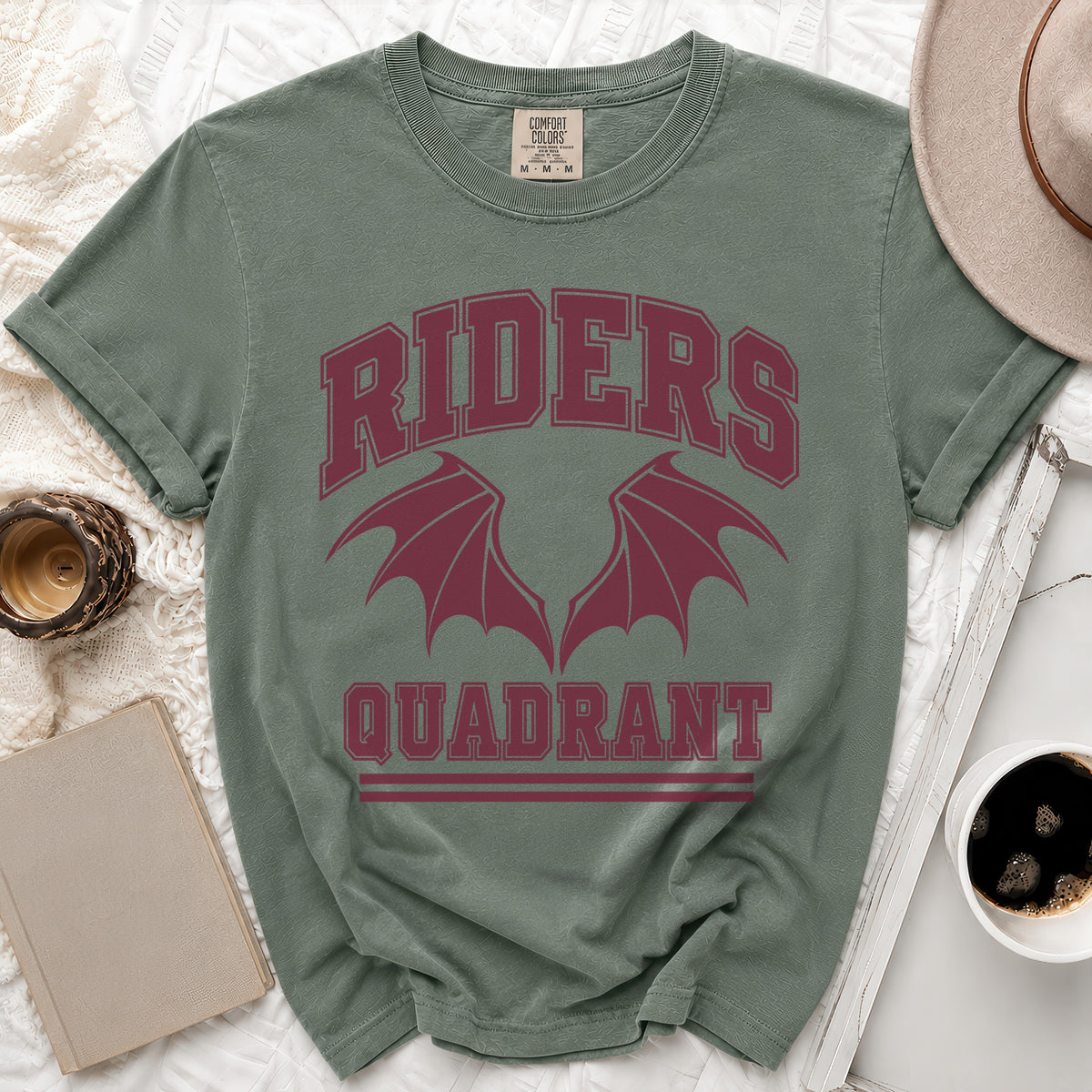 Green t-shirt with burgundy "RIDERS QUADRANT" graphic and dragon wings.