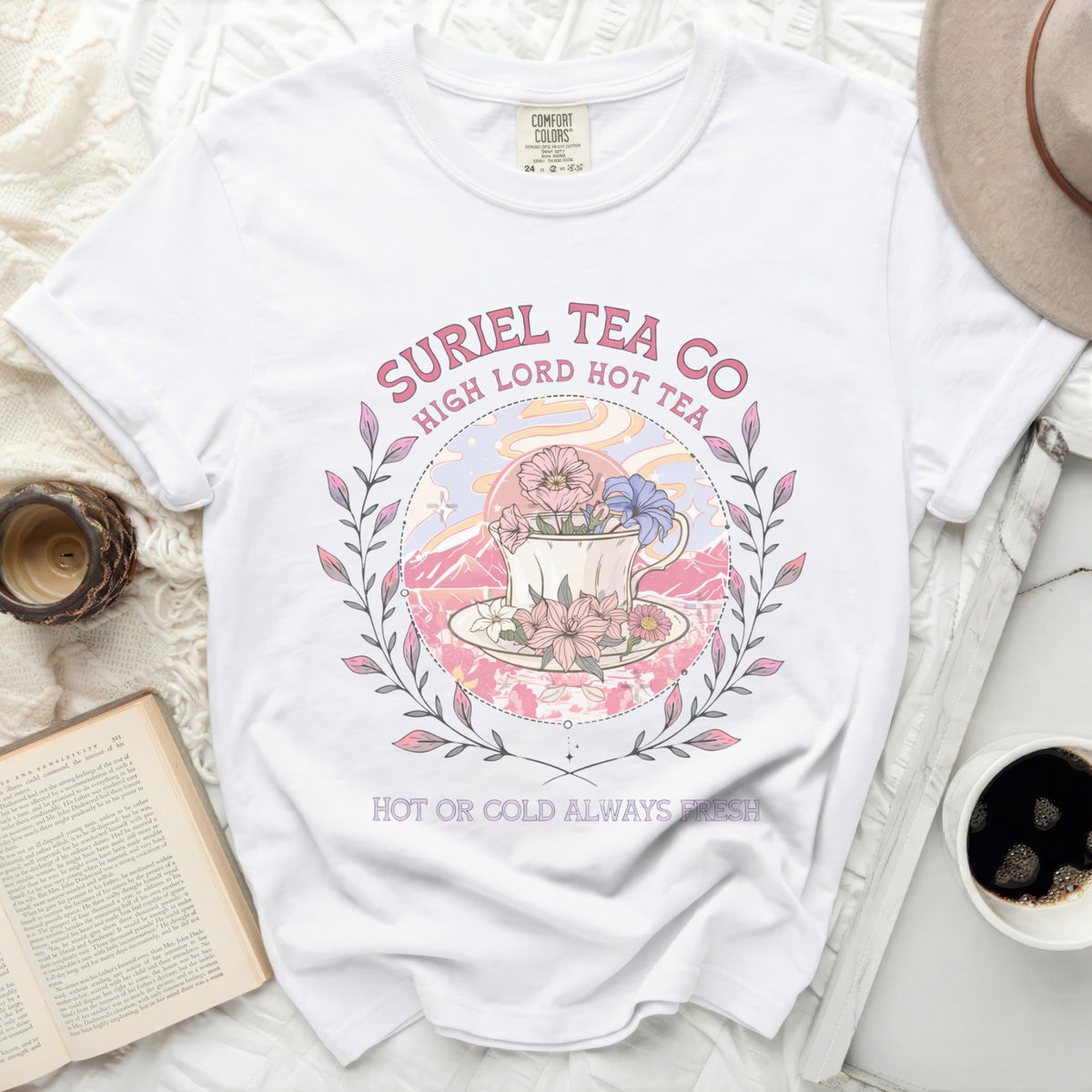 White t-shirt with Suriel Tea Co. graphic featuring a teacup and flowers.