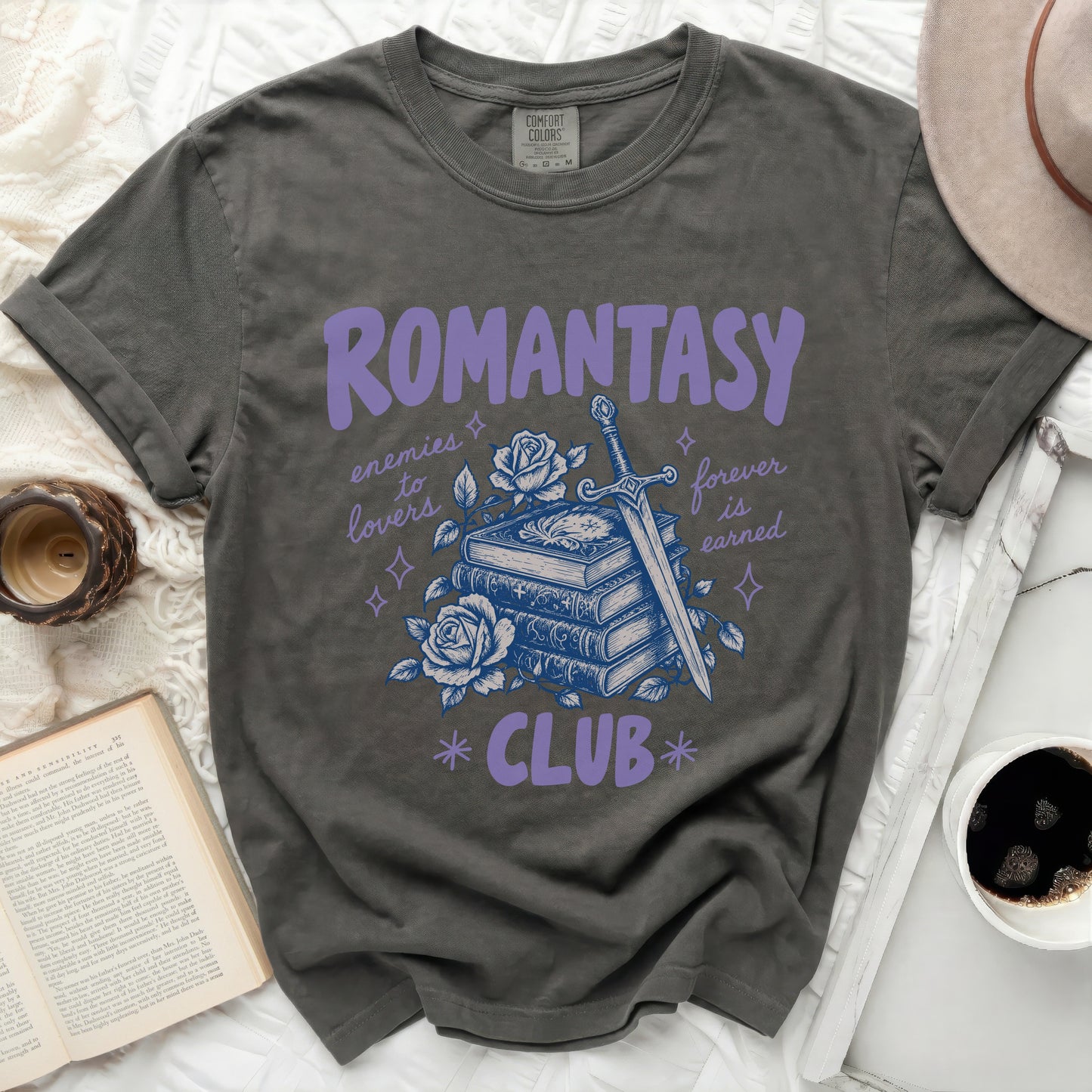 Dark grey t-shirt with "ROMANTASY CLUB" and sword, books, and rose graphic.