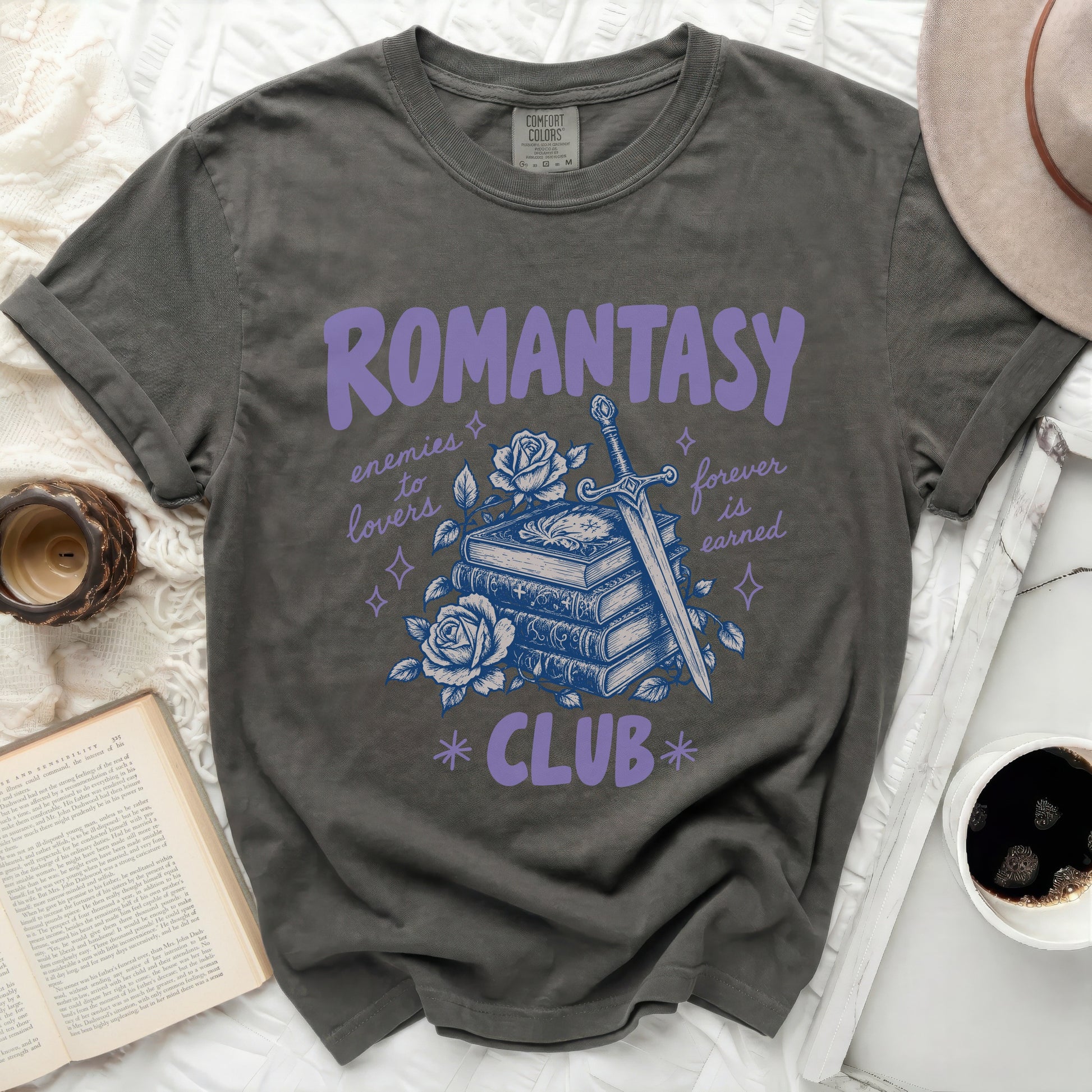 Dark grey t-shirt with "ROMANTASY CLUB" and sword, books, and rose graphic.