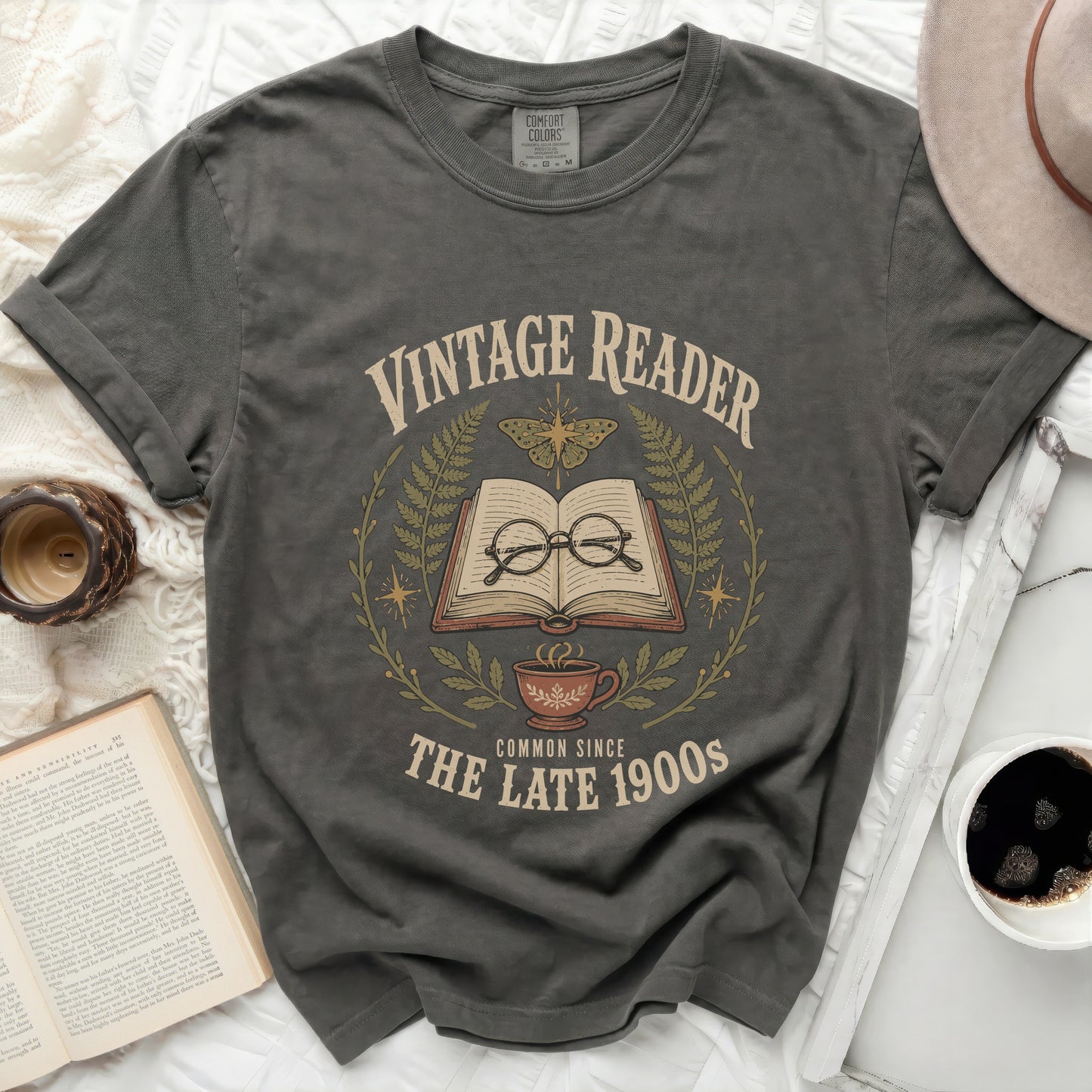 Vintage Reader graphic with open book, glasses, butterfly, and coffee cup