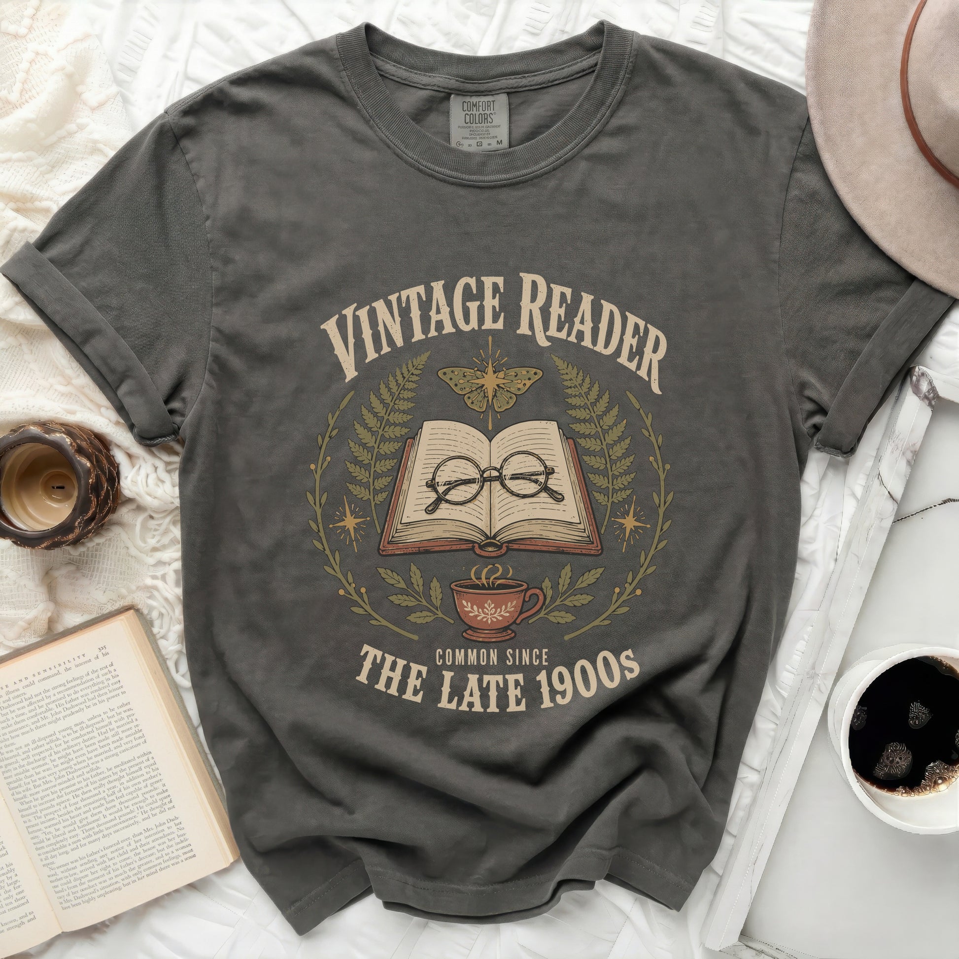 Vintage Reader graphic with open book, glasses, butterfly, and coffee cup