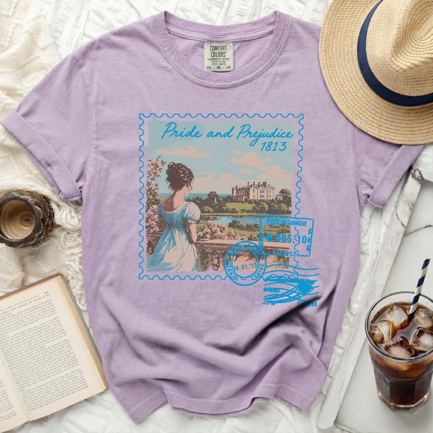 Purple t-shirt featuring a vintage "Pride and Prejudice" stamp graphic.