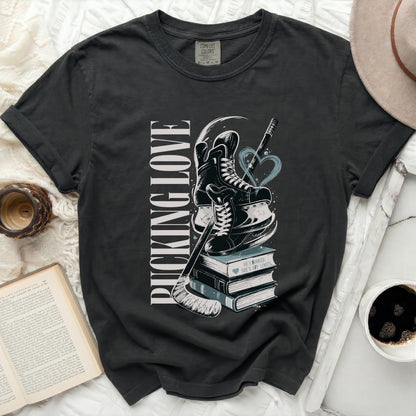 Black t-shirt with "Pucking Love" and hockey graphics on books.