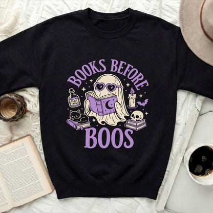 Black sweatshirt with "BOOKS BEFORE BOOS" ghost graphic and Halloween elements.