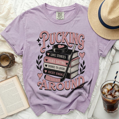 Light purple t-shirt with "Pucking Around" and book graphics.