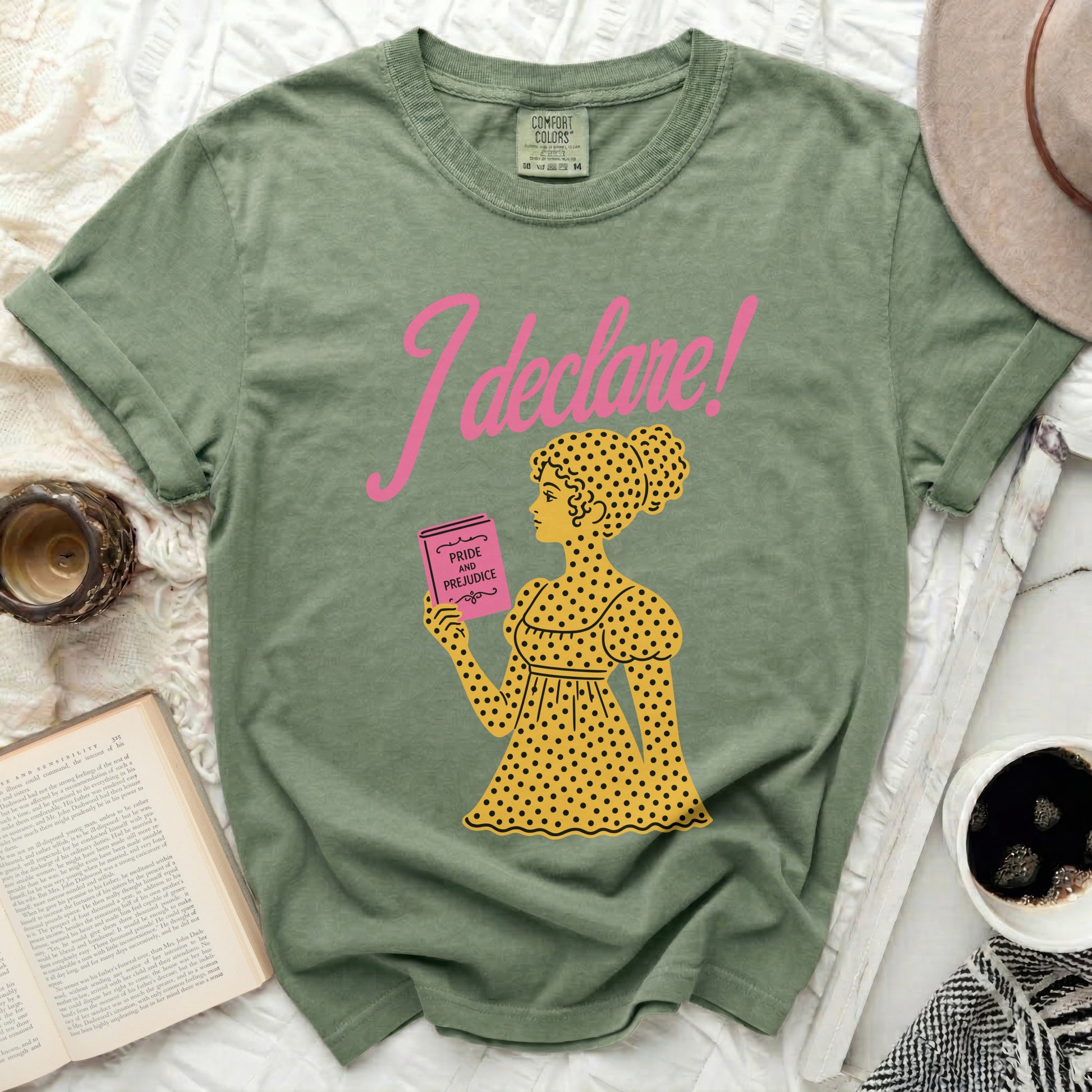 Green t-shirt with "I declare!" and a woman holding "Pride and Prejudice".