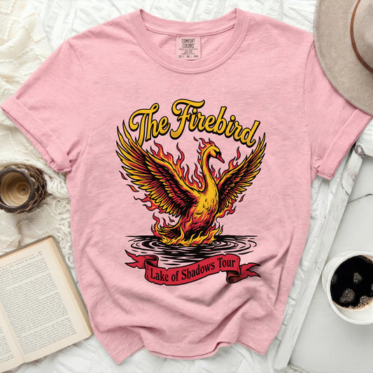 Pink t-shirt with "The Firebird Lake of Shadows Tour" graphic and flaming bird.