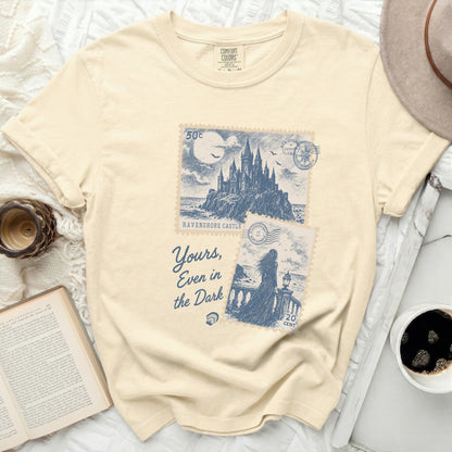 Cream t-shirt with "Ravenshore Castle" and "Yours, Even in the Dark" text.
