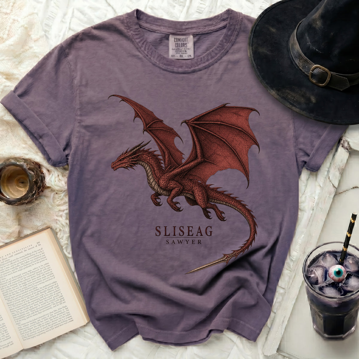 Purple t-shirt with a red dragon graphic and "SLISEAG SAWYER" text.