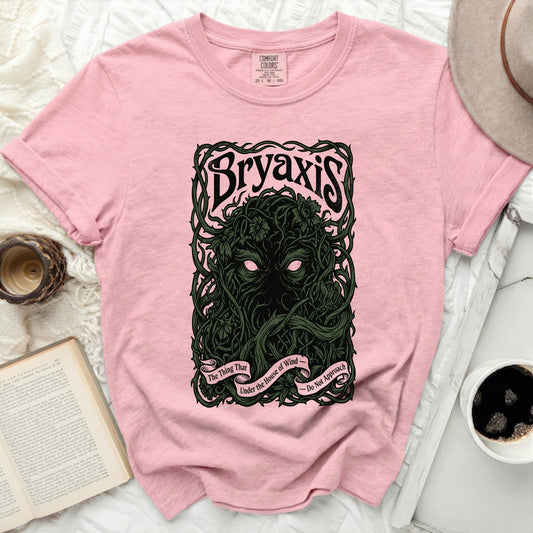 Bryaxis graphic on a pink t-shirt with text "The Thing That Under the House of Wind - Do Not Approach".