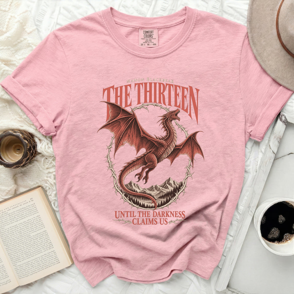 Pink comfort colors tee with a red dragon graphic and text.