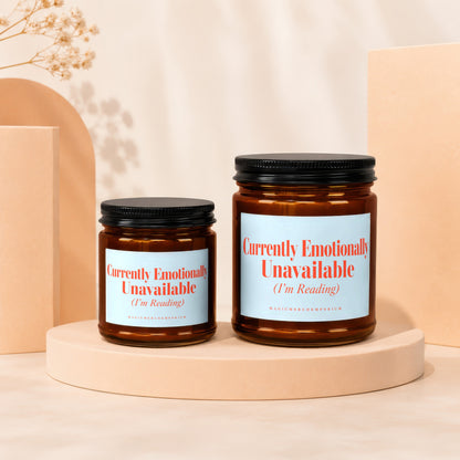Two amber glass candles with black lids and "Currently Emotionally Unavailable (I'm Reading)" labels.