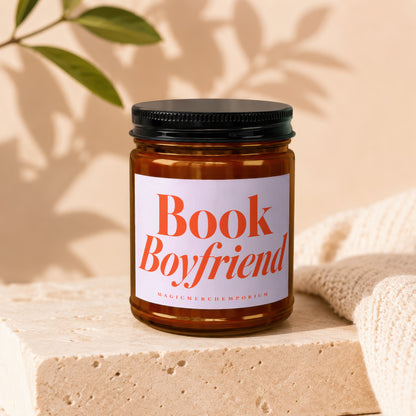 Amber jar candle with "Book Boyfriend" label and "MagicMerchEmporium" text.