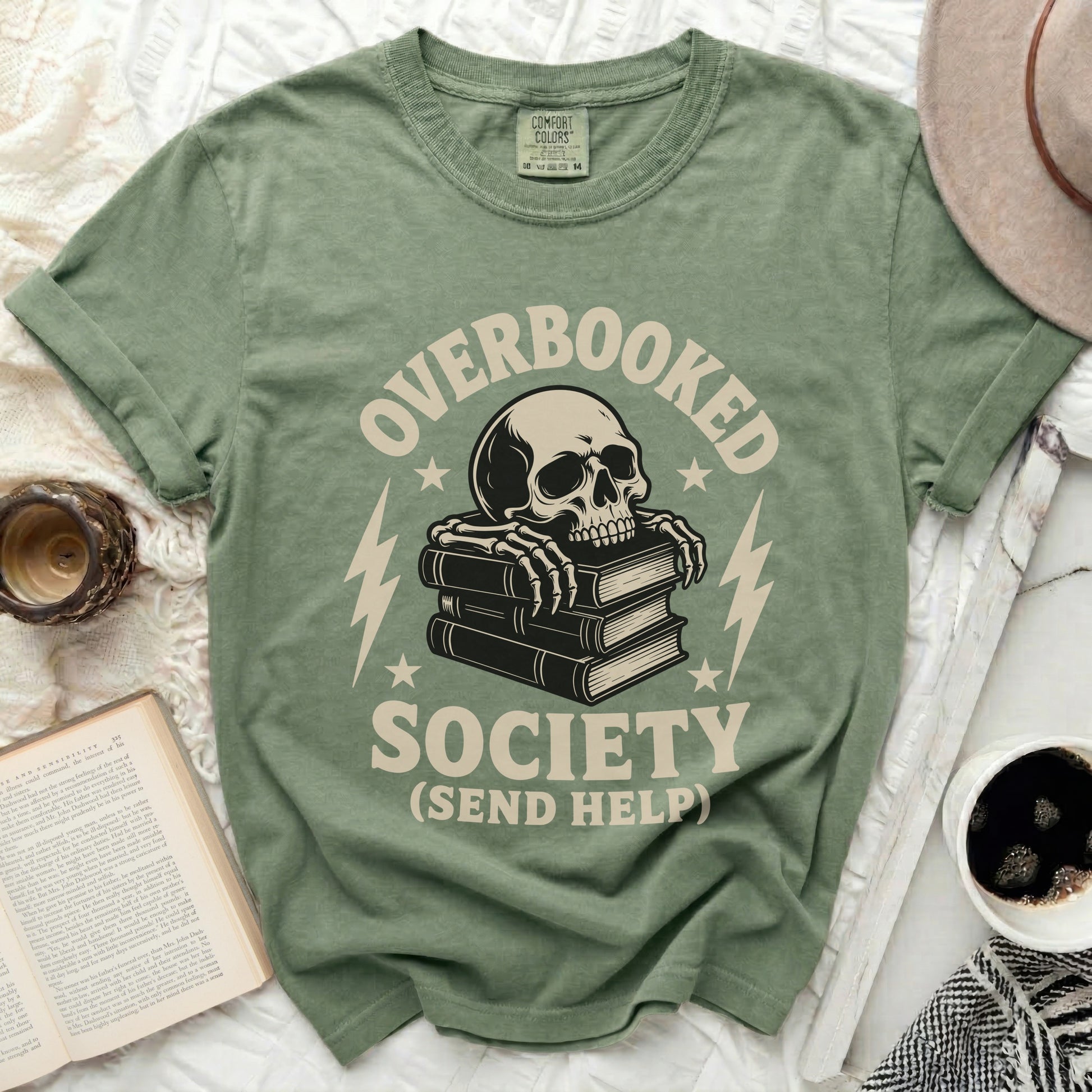 Green t-shirt with skull on books text "OVERBOOKED SOCIETY (SEND HELP)"
