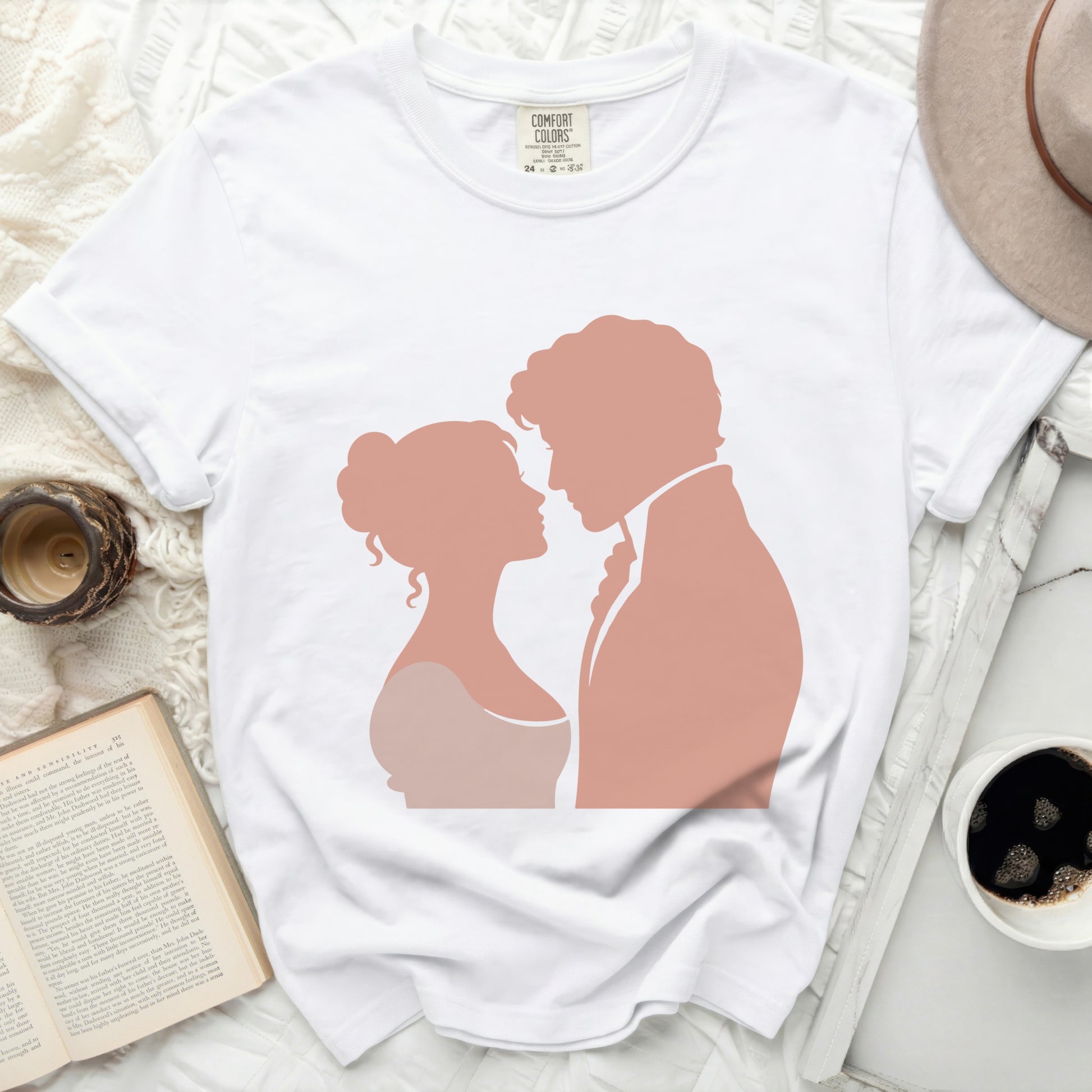 White t-shirt with pink silhouettes of a couple embracing.