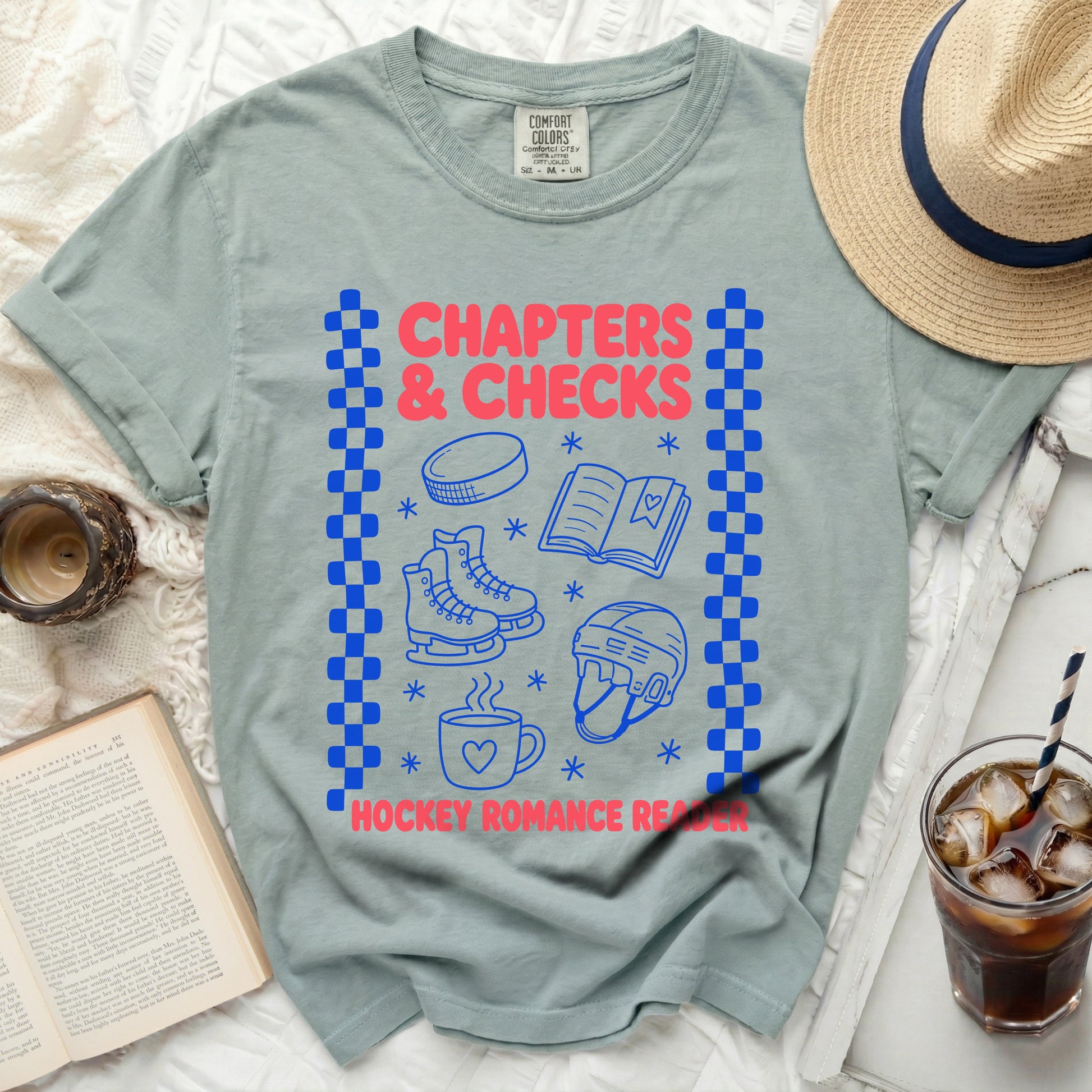 Green t-shirt with "Chapters & Checks" and hockey graphics.