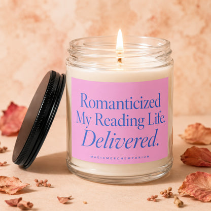 Candle with pink label reading "Romanticized My Reading Life. Delivered."